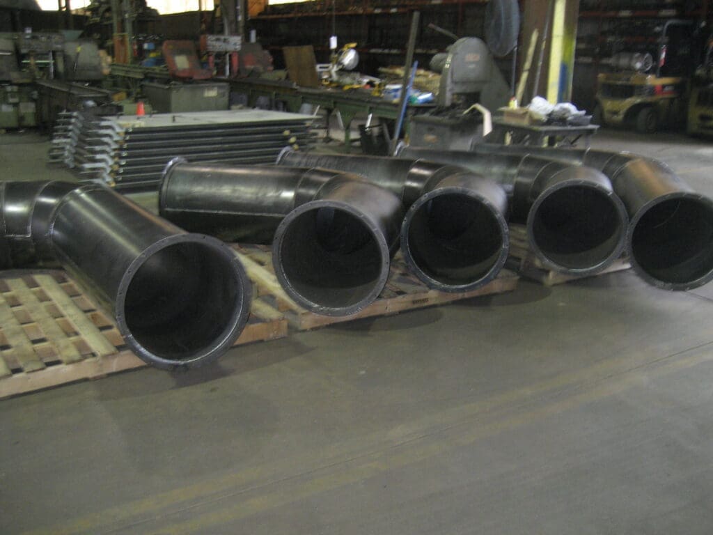 Metal ductwork in a workspace.