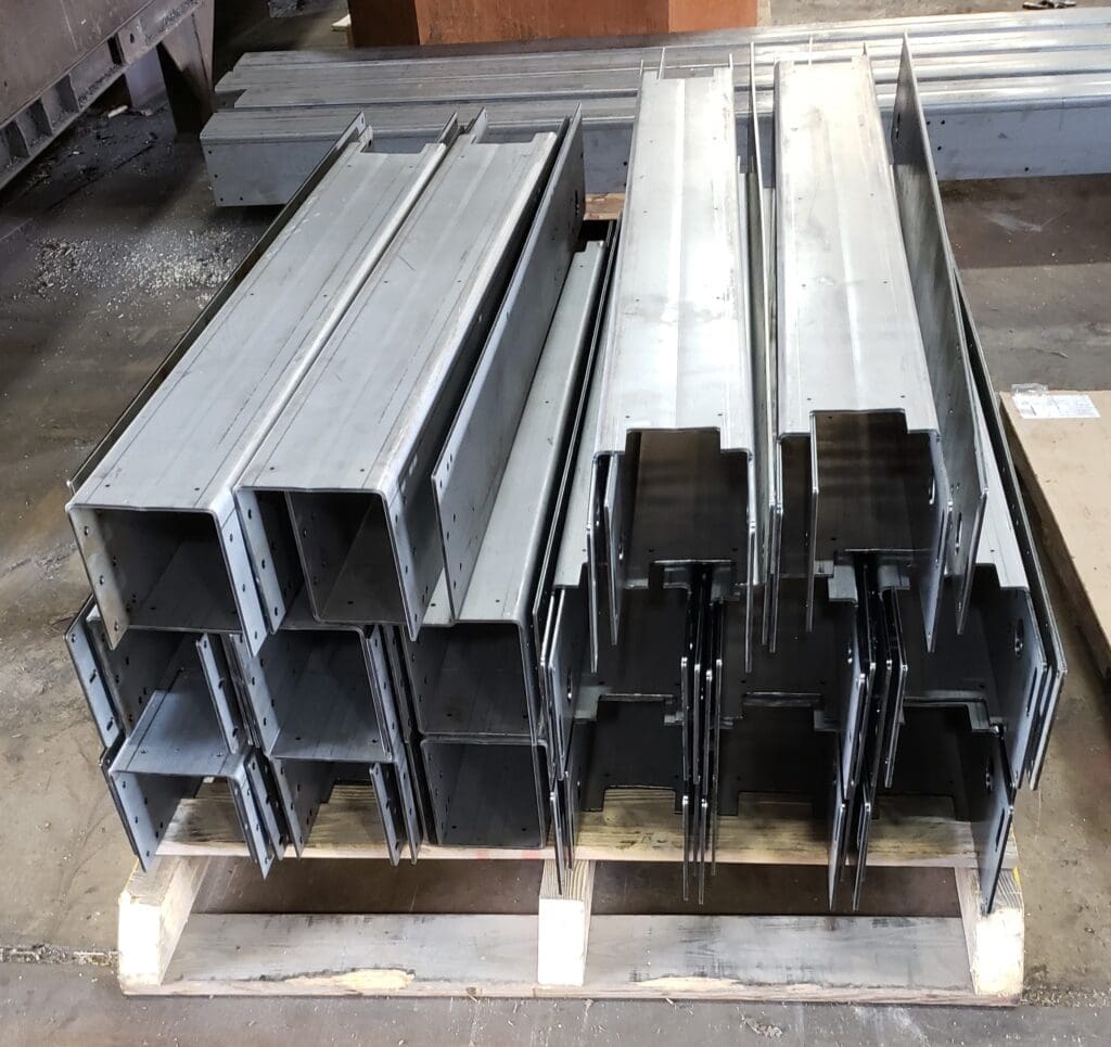 Formed metal sitting on a table.